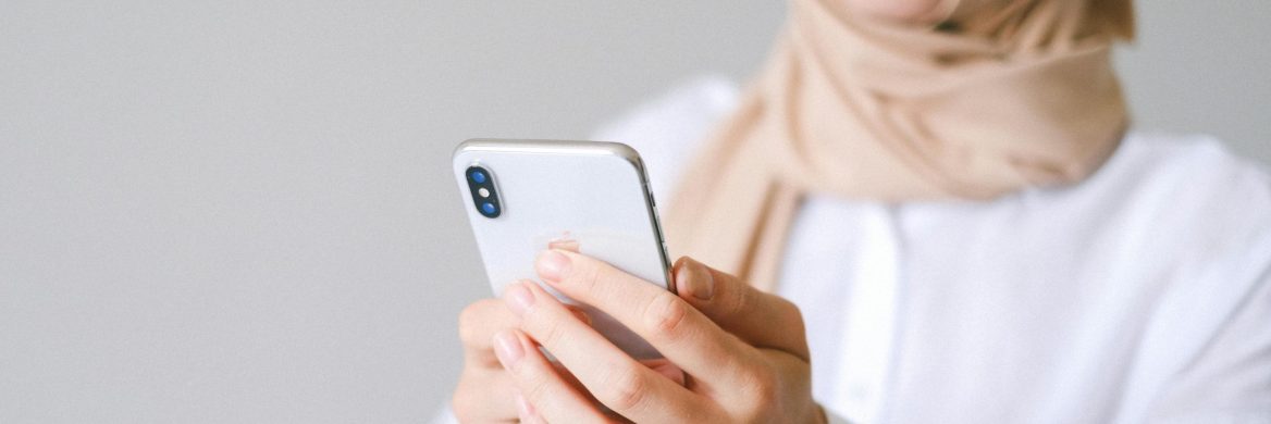 A person looks at their cell phone.