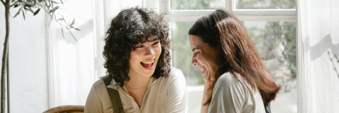 Two people smile as they discuss tax law changes.