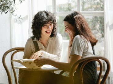 Two people smile as they discuss tax law changes.